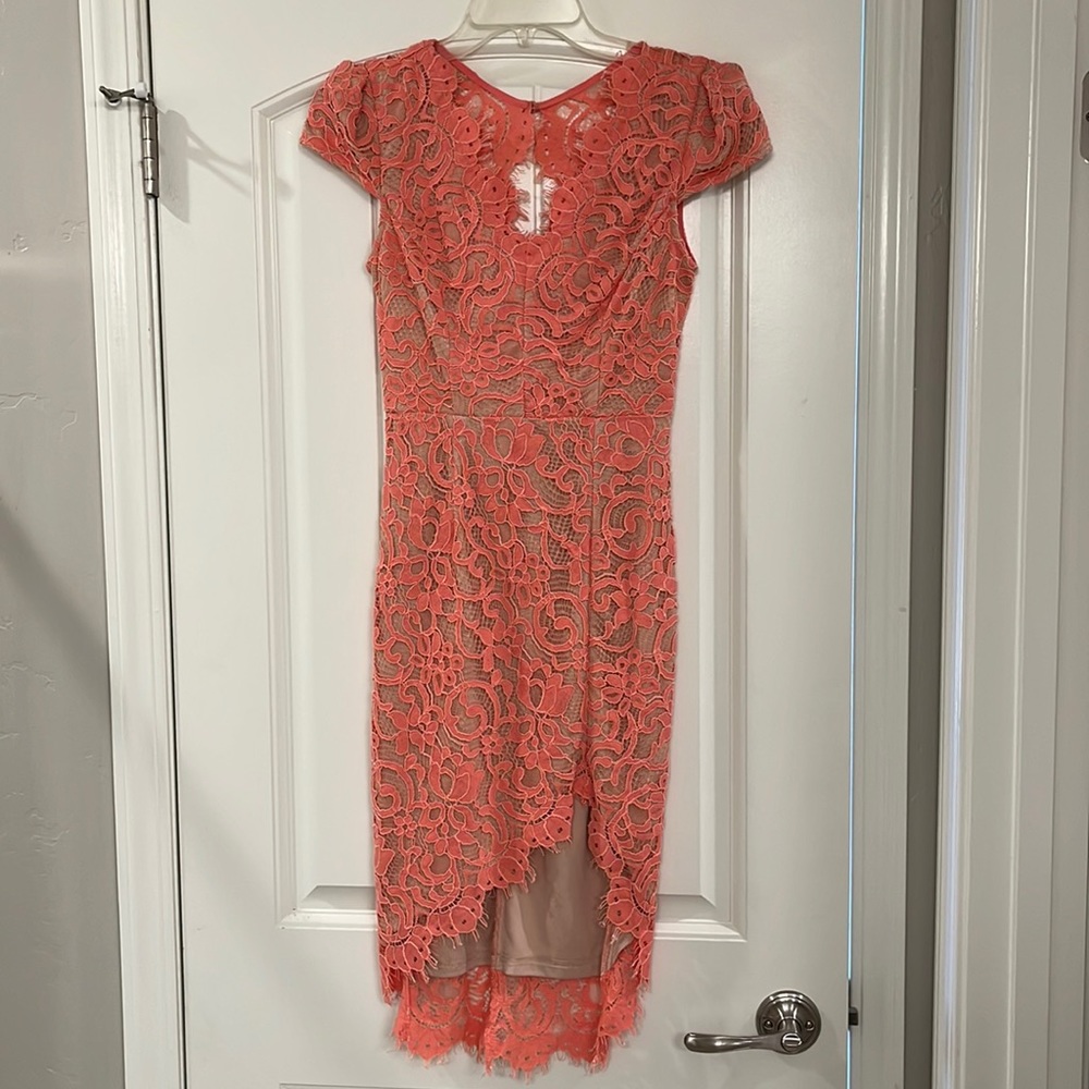 Coral open back lace mini dress